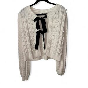 A loves a cream sweater